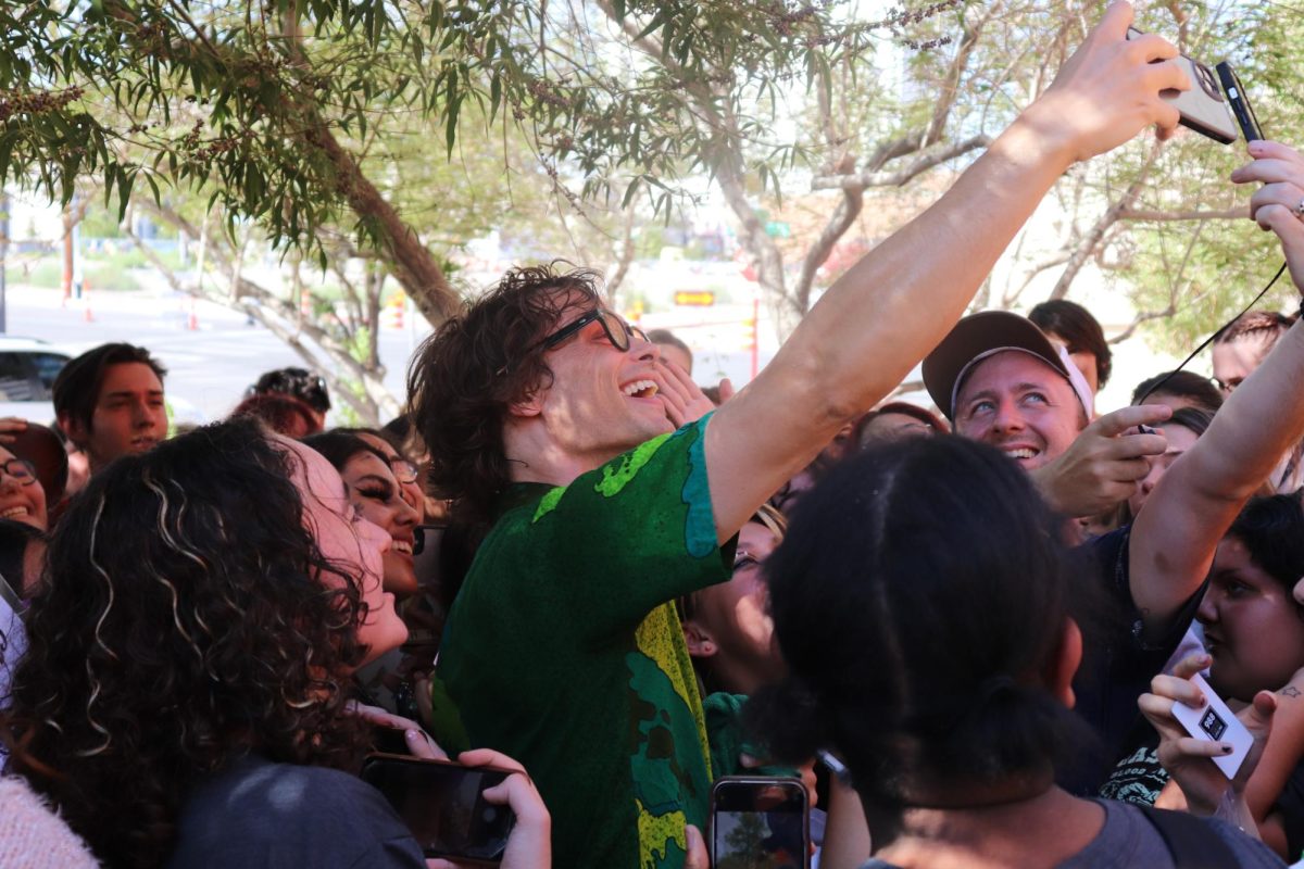 LVA students happily pose with Mathew Gray Gubler as he snaps a group selfie with the fans gathering to meet him. 