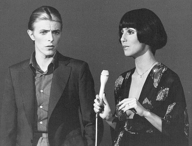 David Bowie and Cher 1975. Image licensed under https://garystockbridge617.getarchive.net/amp/media/david-bowie-and-cher-1975-d567af
