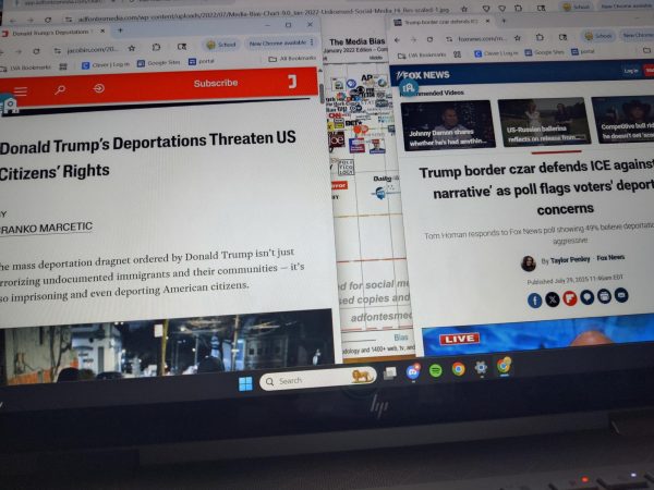 Laptop displaying The Jacobin, Fox News, & the Ad Fontes Media Bias chart