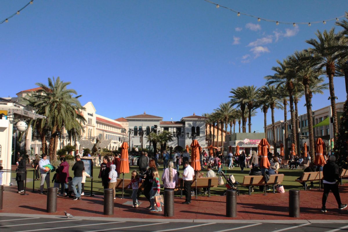 People gather near the lawn at Town Square on a nice winter afternoon.